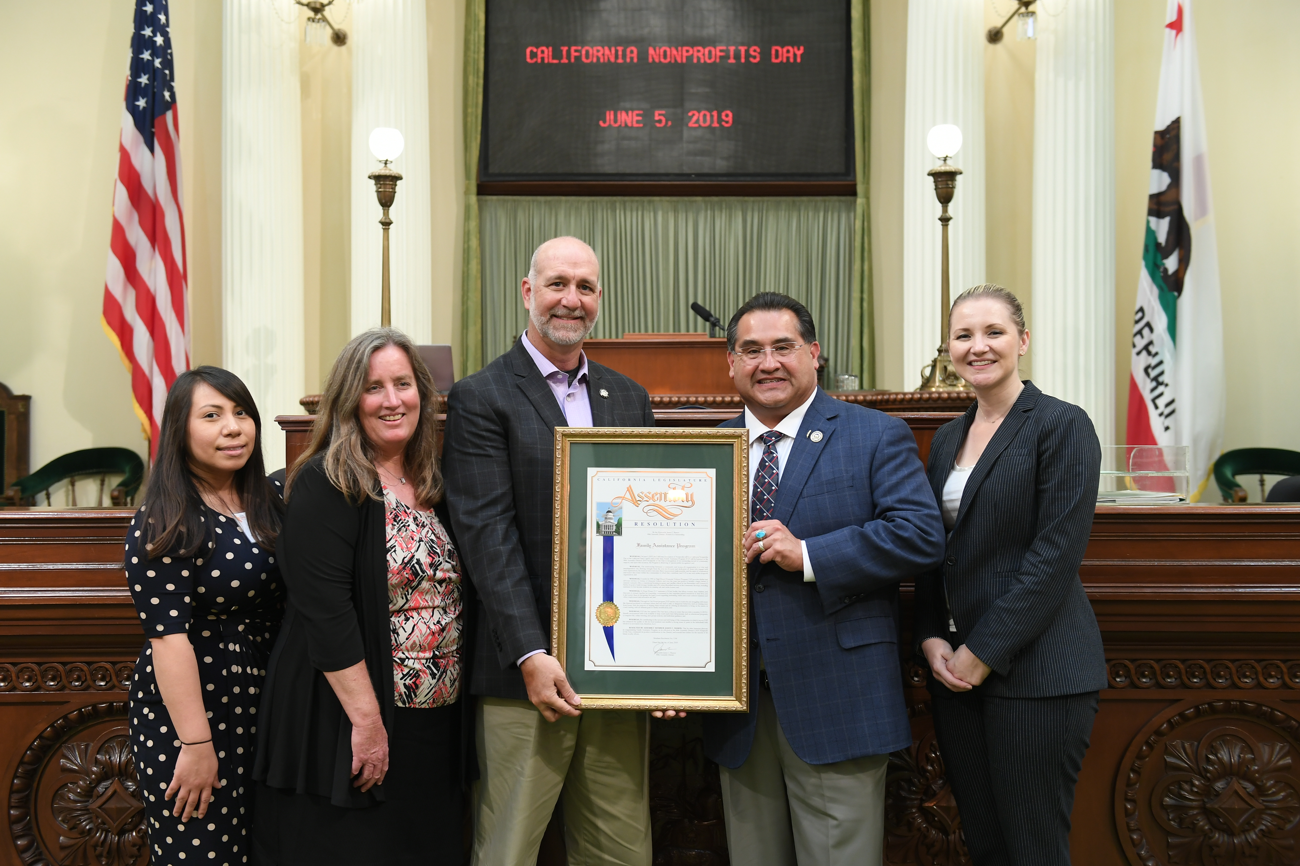 Assemblymember James C. Ramos presents Family Assistance Program with a certificate of recognition