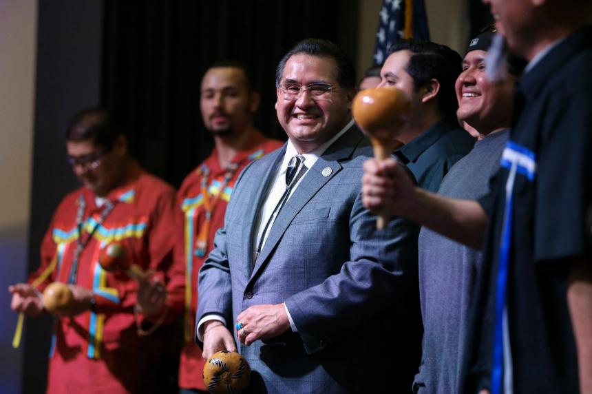 Assemblymember Ramos performing inter-tribal bird songs at his swearing-in reception