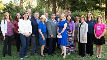 AB 2137 Advocates standing in a group with Assemblymember Ramos