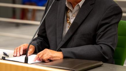 Older gentlemen speaking at the Select Committee on Native American Affairs