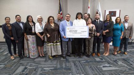 Big check group photo with Assemblymember Ramos, students, college officials, electeds, and tribal leaders.