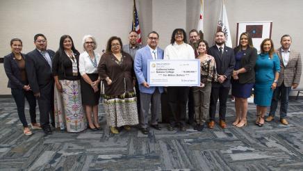 Big check group photo with Assemblymember Ramos, students, college officials, electeds, and tribal leaders.