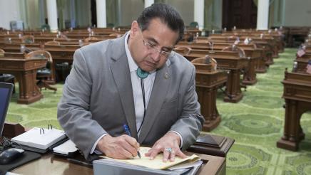Assemblymember Ramos signing bill